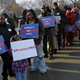 Activists hold signs supporting the Voting Rights Act. (Mandel Ngan/AFP/Getty Images)